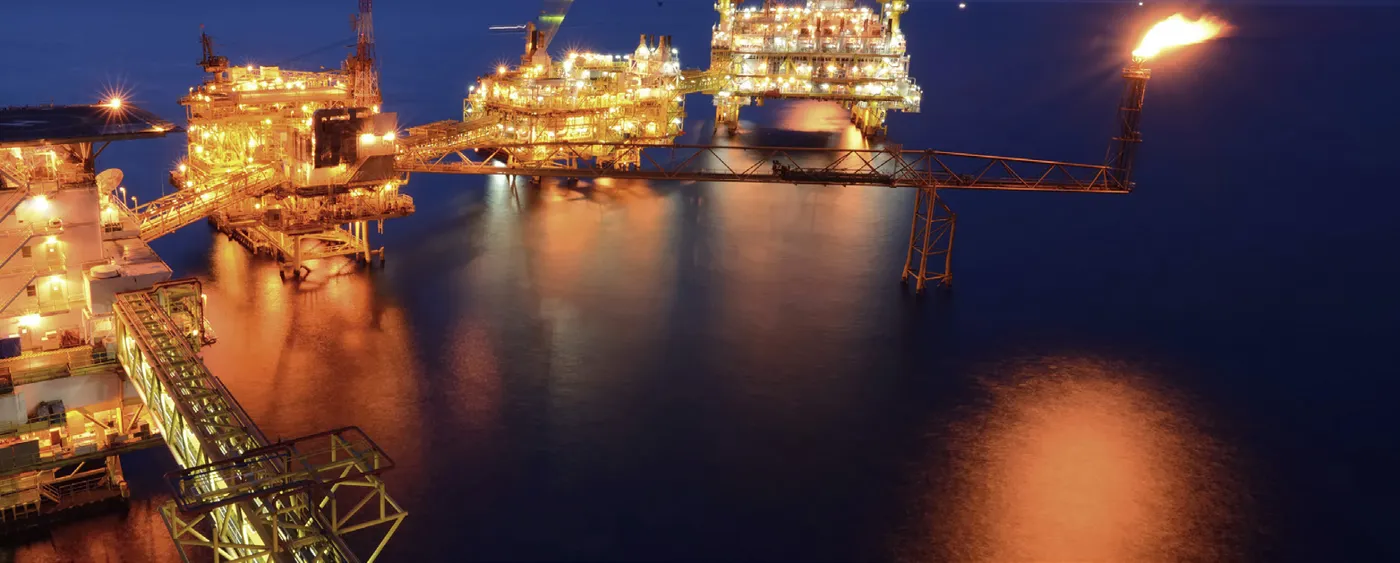 Offshore production platforms lit at night